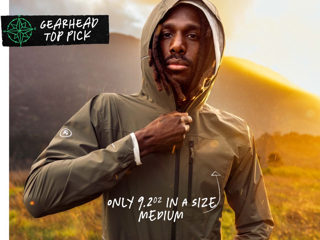 A man zips up a jacket as the golden sun sets behind him. Text overlay reads: Gearhead top pick, only 9.2oz in a size medium.